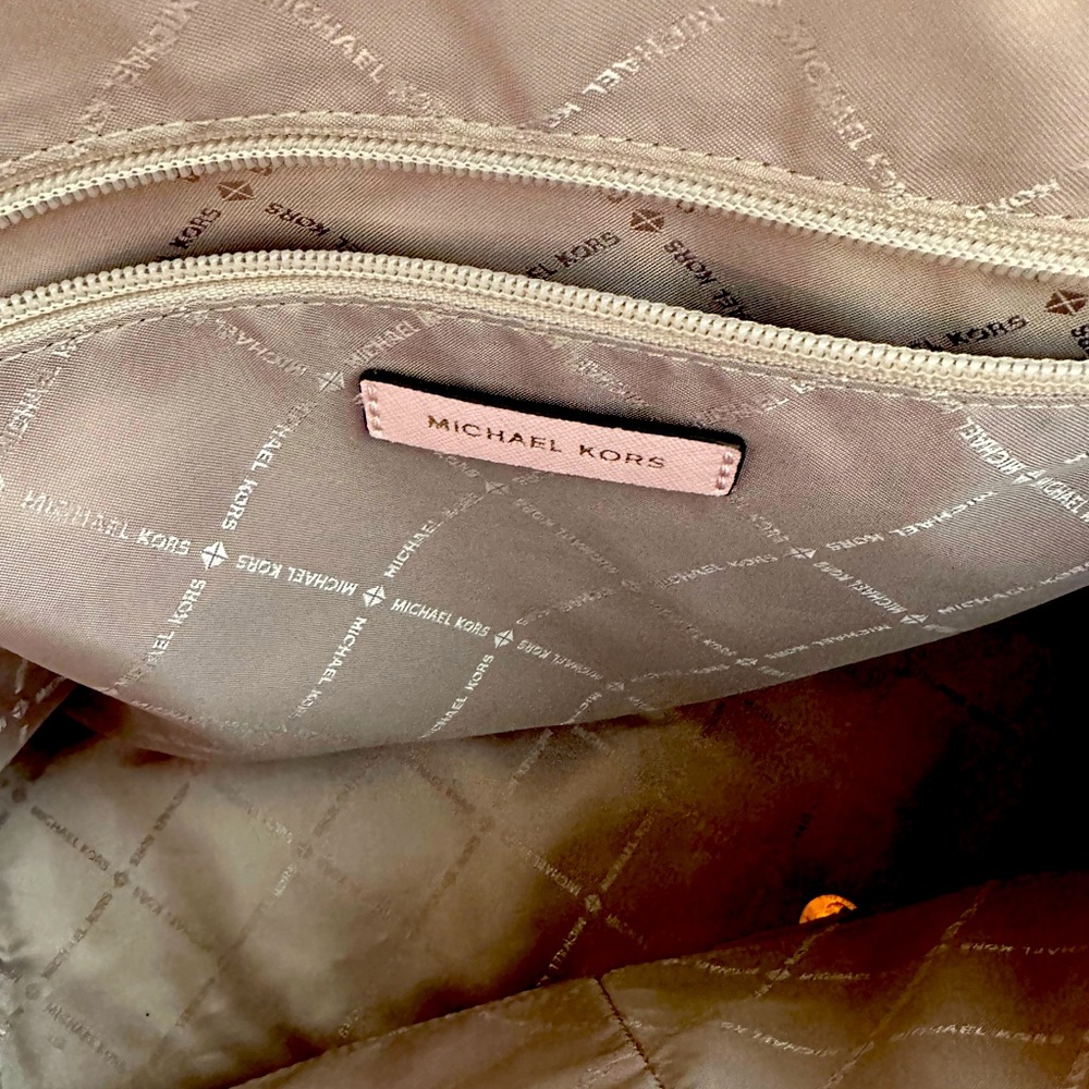 Michael Kors pink pocket book.